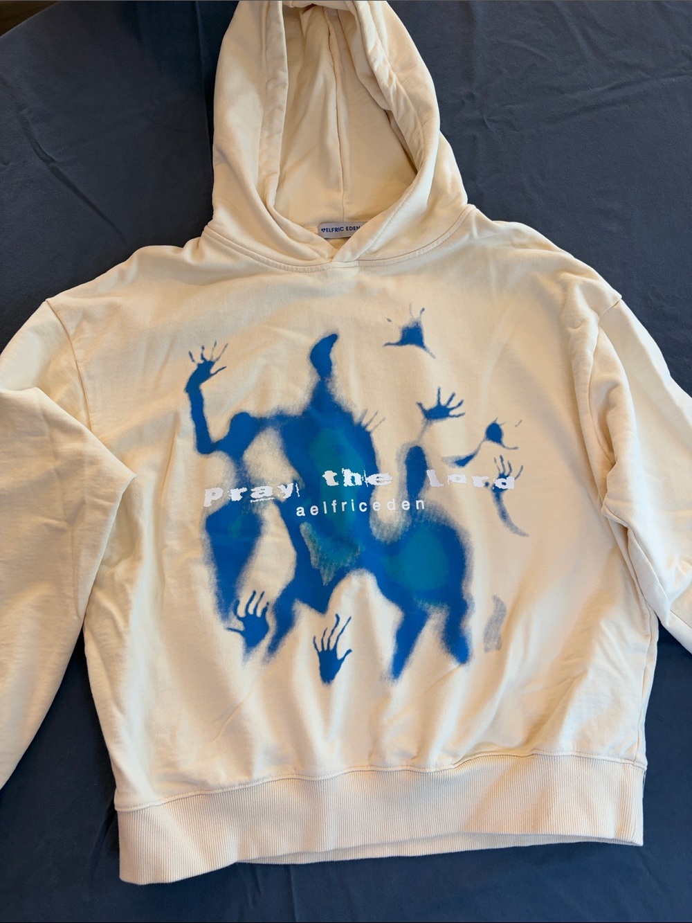 Elfric Eden Cream Crewneck Hoodie with Blue Graphic